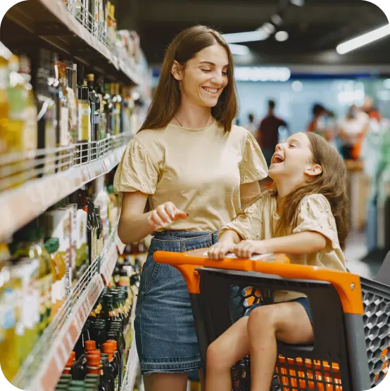 Woman with her daughter in the supermarket